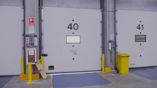 Loading docks for trucks in logistics warehouse