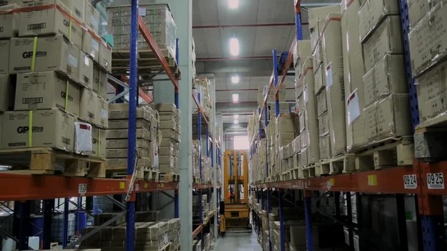 Pallet truck working in warehouse
