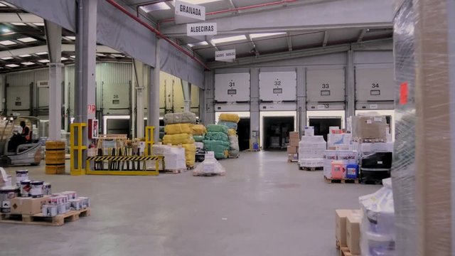 Pallet truck working in warehouse
