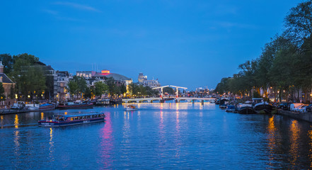 Fototapeta na wymiar Evening view over famous Amstel River in the city of Amsterdam