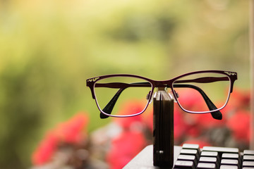 Image of congratulations on Teachers Day in modern style: big glasses, small book and keyboard of...