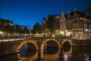 Fototapeta premium Romantic Amsterdam by night - beautiful in the evening