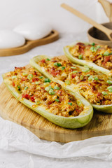 Stuffed zucchini with chicken, tomatoes and onion with cheese crust
