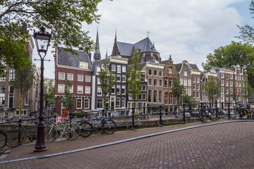 Fototapeta na wymiar The buildings at Gentlemens Canal in Amsterdam - AMSTERDAM - THE NETHERLANDS - JULY 20, 2017