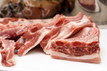 Piece of fresh raw meat ribbon ribs before baking