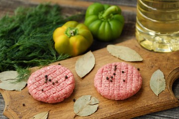 Beef patties for frying with pepper and vegetables  