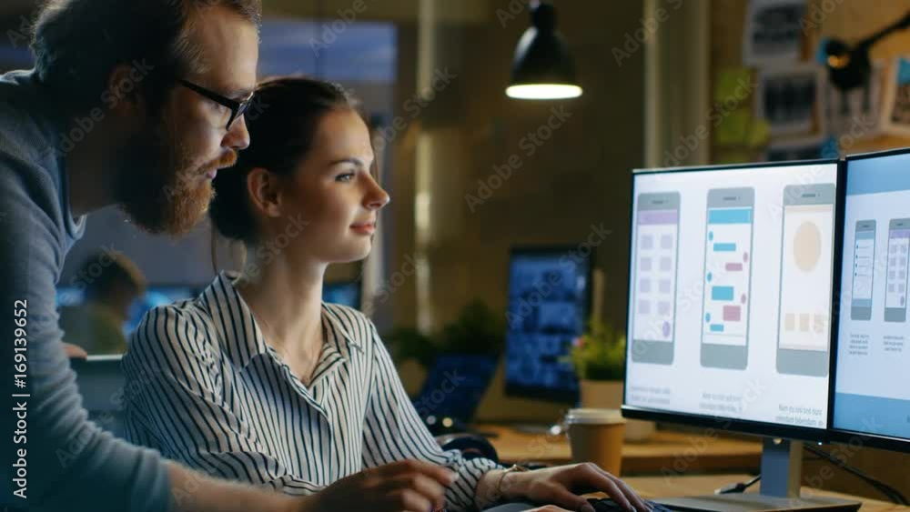 Aufkleber female ux architect has discussion with male design engineer, they work on mobile application late a