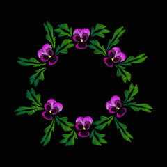 Embroidery of jeans. Smooth. Lilac flowers Pansies. Flower pattern. Round frame. Traditional folk ornament. Vector illustration on a black background