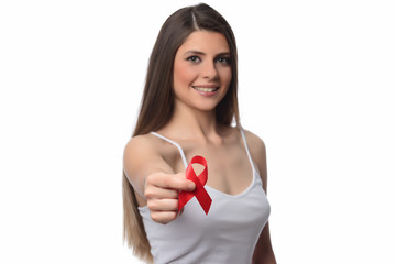 Healthcare and medicine concept - woman holding red AIDS HIV awareness ribbon