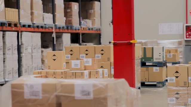 Palletizing machine working in warehouse
