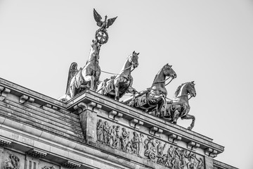 Obraz premium Quadriga statue on famous Brandenburg gate in Berlin - Brandenburger Tor