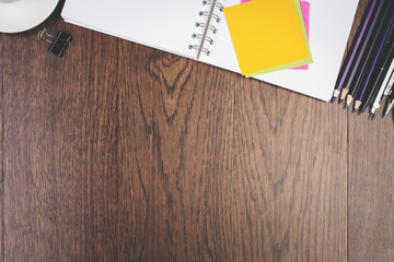 Blank wooden desktop with supplies