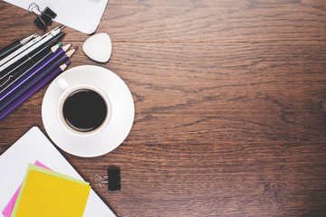 Clean wooden desktop with supplies