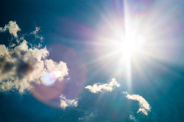 blue sky with sun flares in sunny summer day