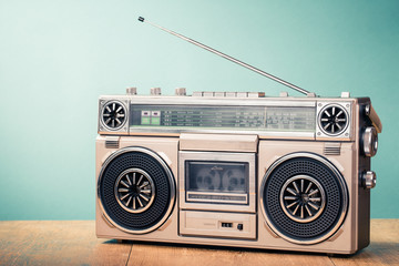 Retro radio recorder from 80s front mint green background. Vintage old style filtered photo