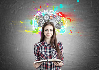 Pretty geek girl with a book and brain cogs