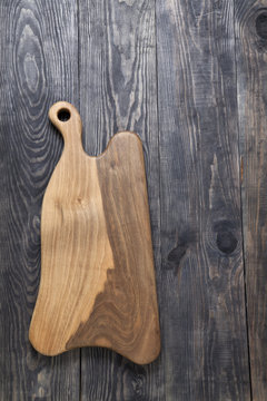 Cutting board on a wooden surface