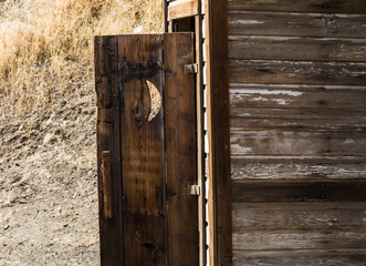 Door Left Open to Authentic Outhouse 