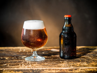 Composition of beer glass and some bottles