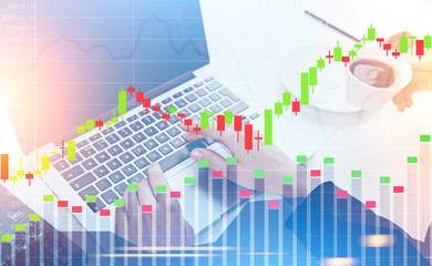 Woman s hands on keyboard, graphs