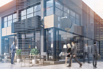 Cafe with a round and a rectangular sign, toned