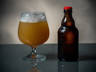 Composition of beer glass and some bottles