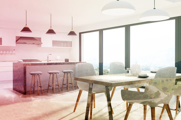 Kitchen with a bar and a table