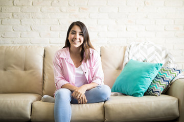 Good looking woman in her cozy apartment