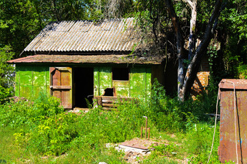 Destroyed houses in which people lived in a dead radioactive zone. Consequences of the Chernobyl...