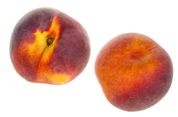 Two peaches isolated on white background. Detail of healthy fresh fruit full of vitamins and antioxidants.