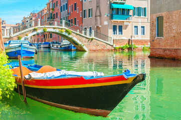 Fototapeta na wymiar Boat floating on a canal, Venice Italy