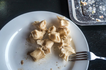 The rest of khinkali on a plate, food waste