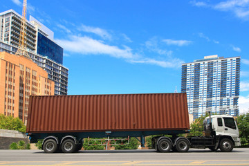 White van with Free Shipping and office buildings in the city , Delivery truck drives through a city in the day, transportation business
