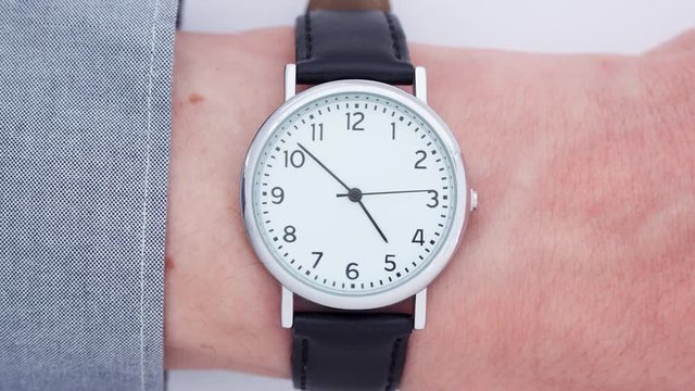 Close up of a man wearing a wrist watch