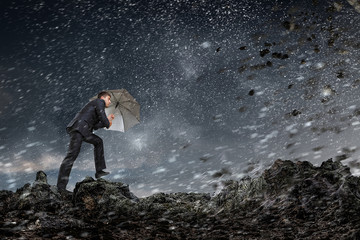 Businessman with black umbrella. Mixed media