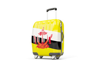 Luggage with flag of brunei. Suitcase isolated on white