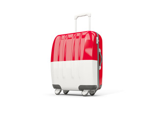 Luggage with flag of indonesia. Suitcase isolated on white