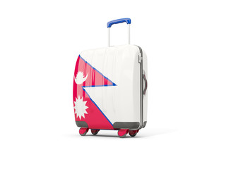 Luggage with flag of nepal. Suitcase isolated on white