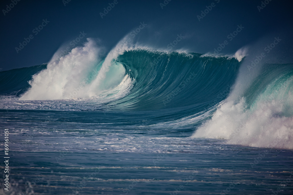 Wall mural big breaking ocean wave crashing on water surface of hawaiian aquatory