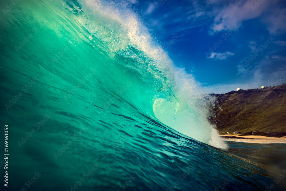Wall mural big ocean green wave. water surface in barrel surfing shape.