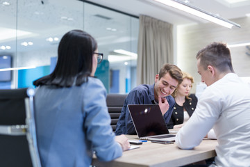 Startup Business Team At A Meeting at modern office building