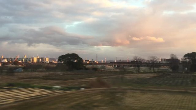 blurred buildings and scene in japan country from speedly moving train