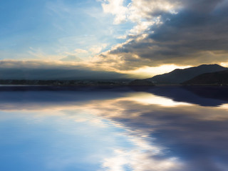 landscape view from kawaguchi lake with cloudy sky and fuji mountain background (soft focus) from japan