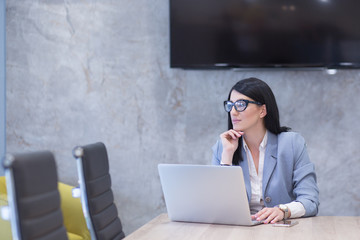 businesswoman using a laptop in startup office