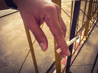 white cigarette in left hand , campaign for world no tobacco day