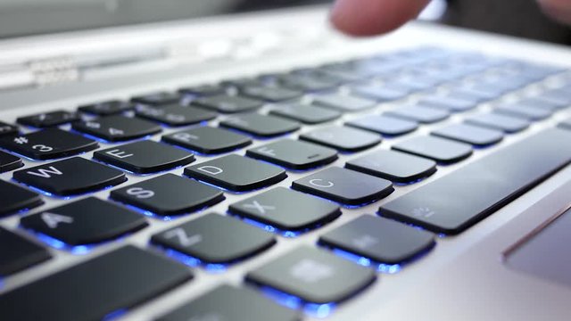 Motion of people typing windows word on keyboard at Microsoft store