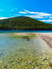 Agios Nikolaos beach in the middle of two islands in Syvota, Greece