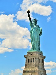 Fototapeta premium The Statue of Liberty in New York City with a blue sky background