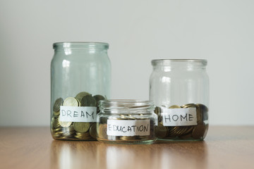 Coins in jars, education, dream and home stickers