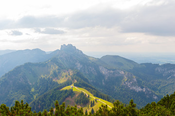 View to Kampenwand from Mount Hochplatte on cloudy summer day